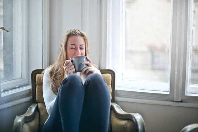Woman relaxing with cup of tea