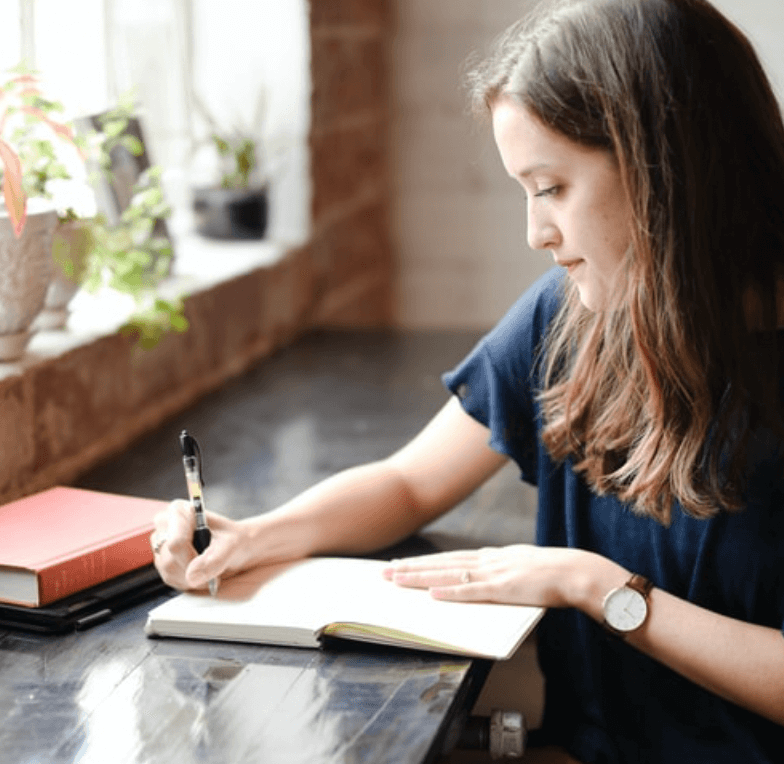 Girl writing at desk